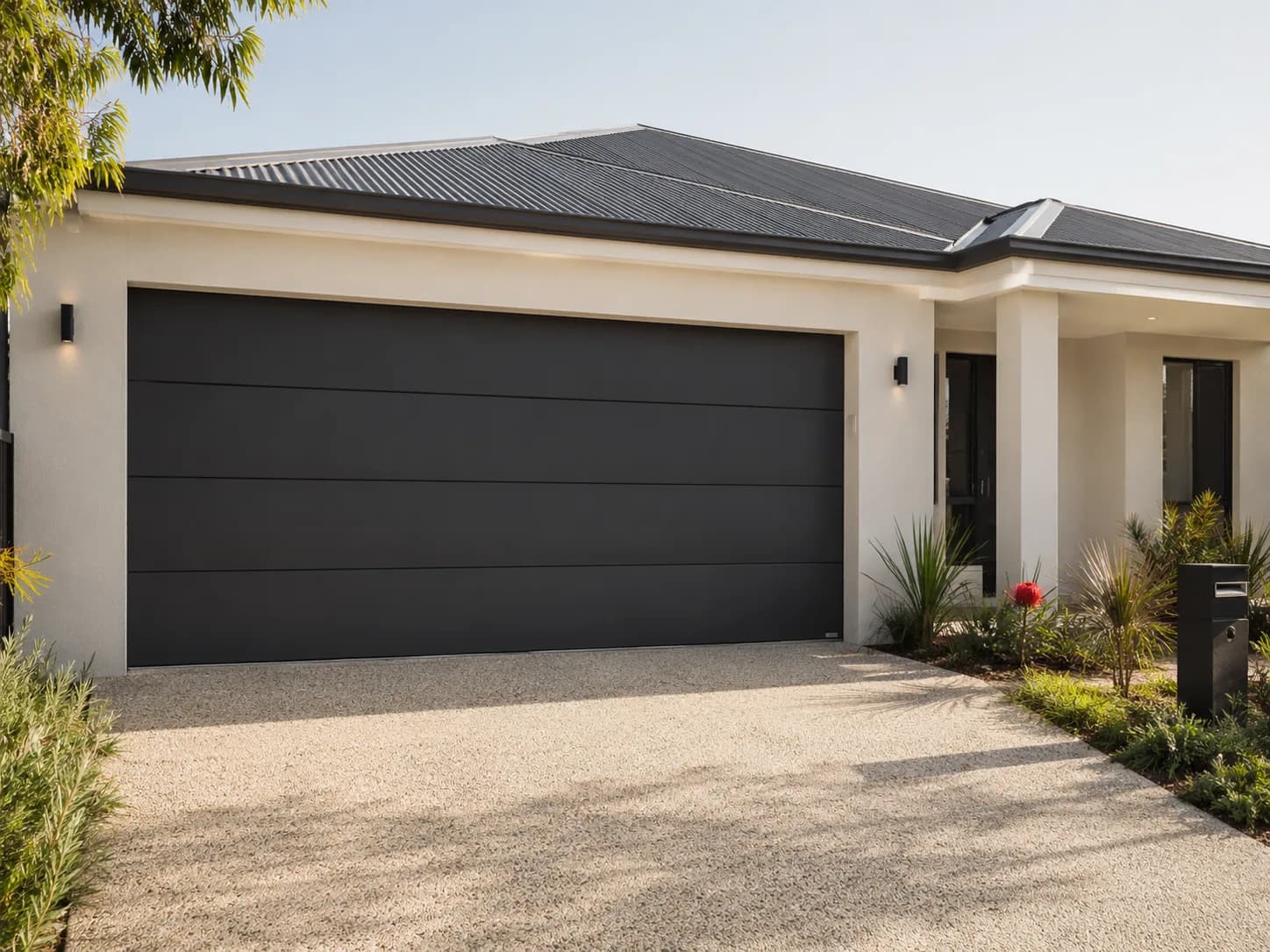 Charcoal sectional garage door on a rendered Perth home, fitted by Elite Garage Doors Perth